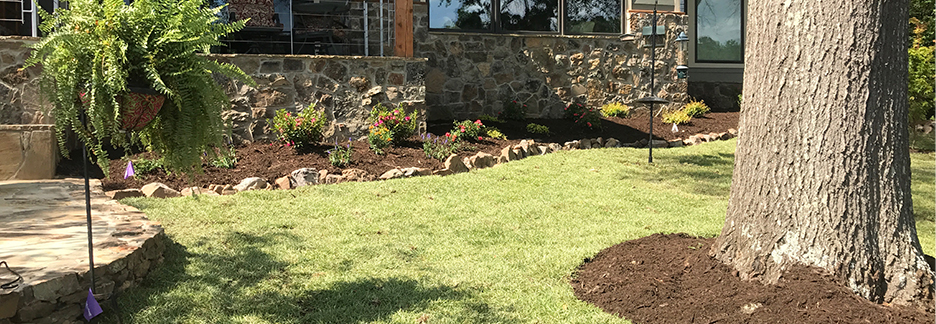 Three Shovels quality lawncare, retaining wall